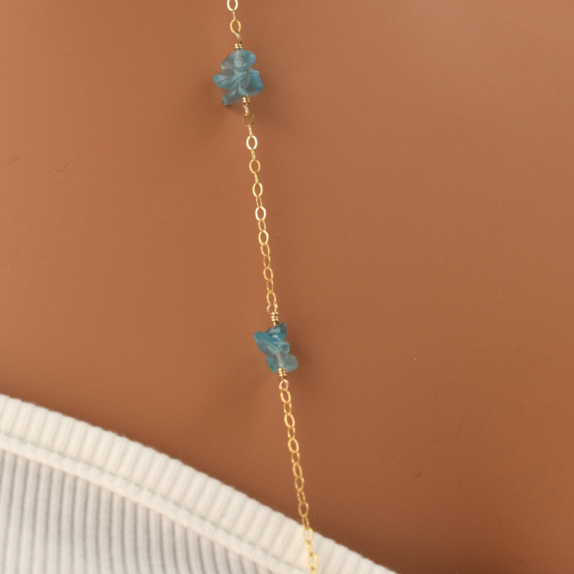 Long blue apatite beaded necklace on 14Kt gold filled chain, 36 inches, close up.