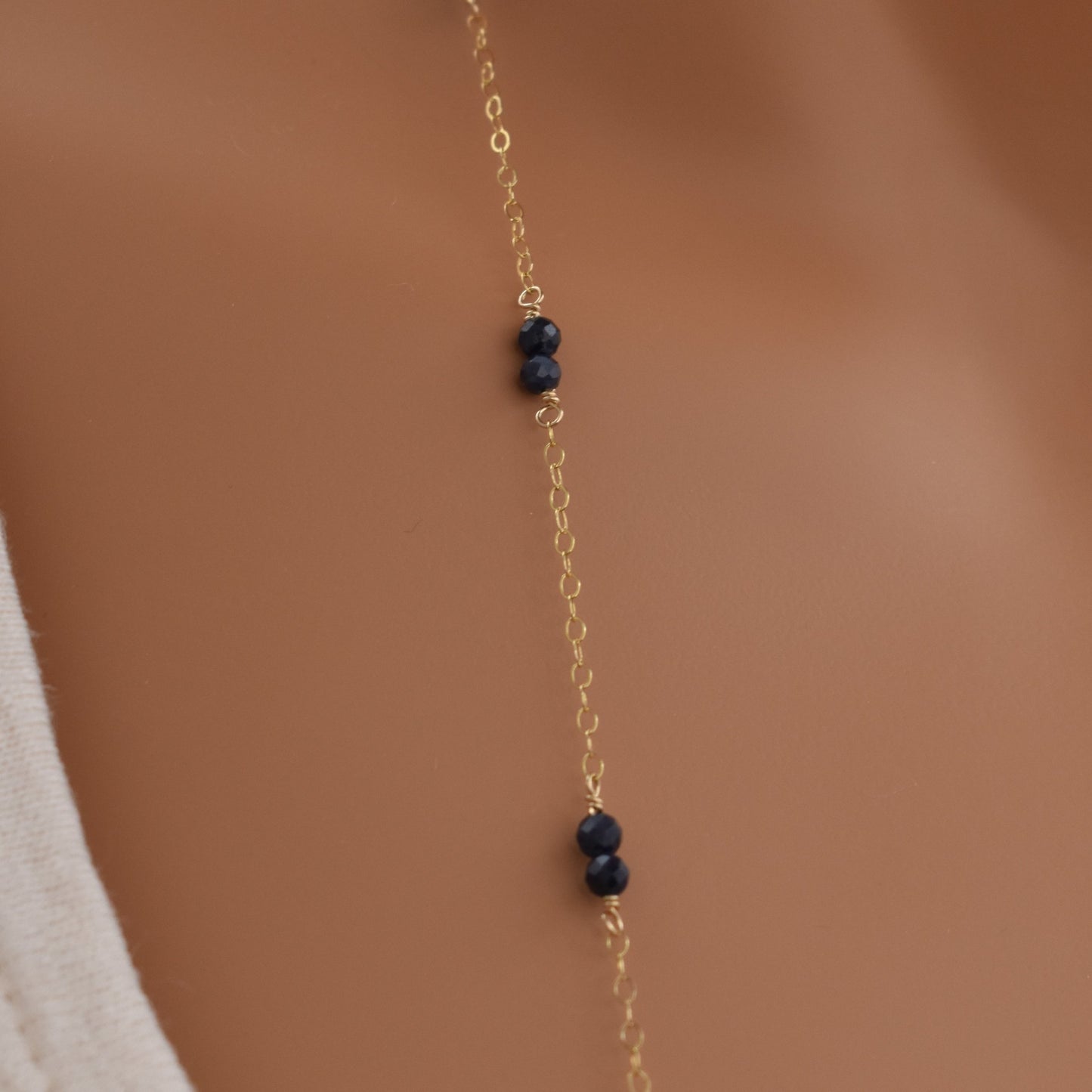 Long blue sapphire bead necklace with 14Kt gold filled chain, 36 inches, close up.