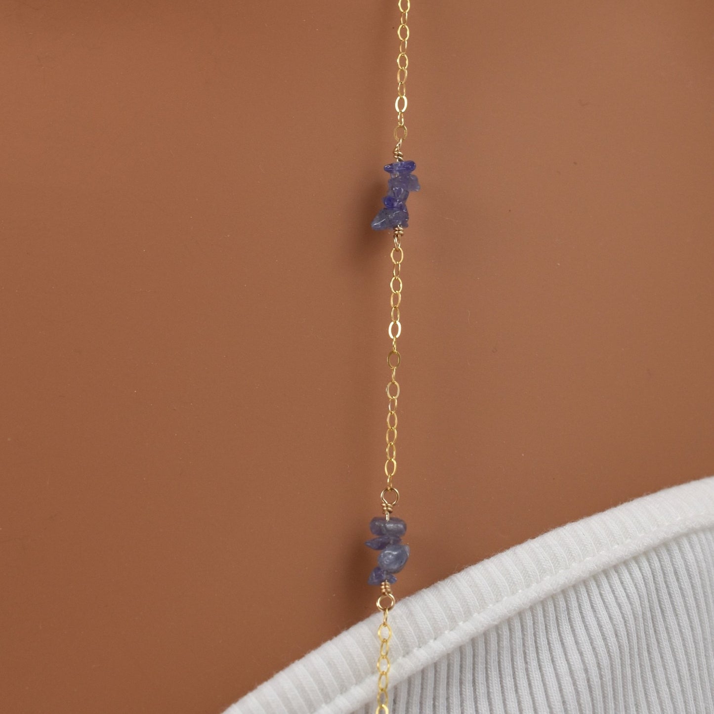 Long tanzanite bead necklace on a 14Kt gold filled chain, 36 inches long, close up.