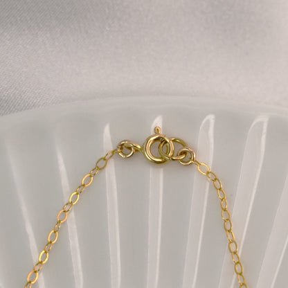 Gold spring ring clasp.