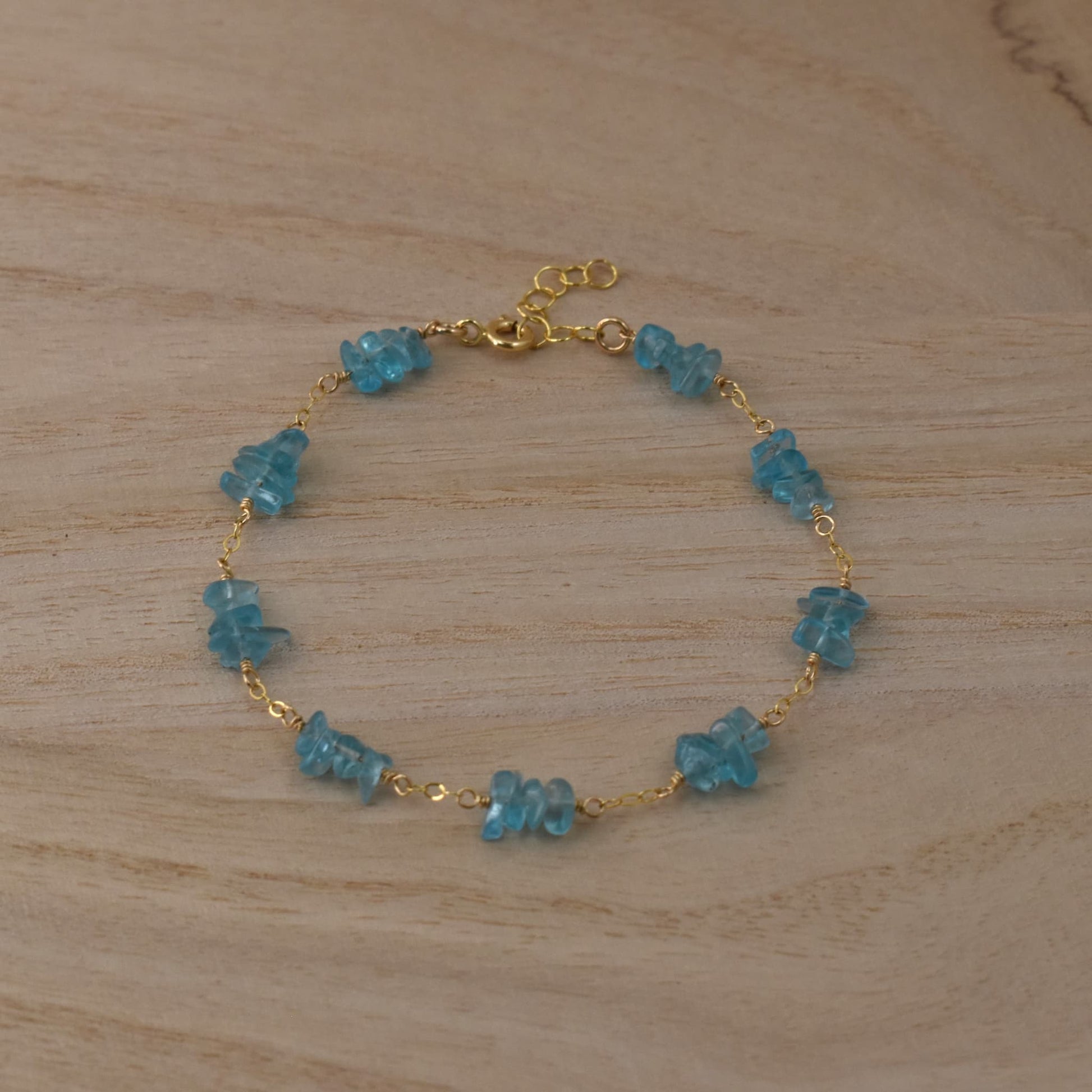 Blue apatite chip bead bracelet with gold chain.