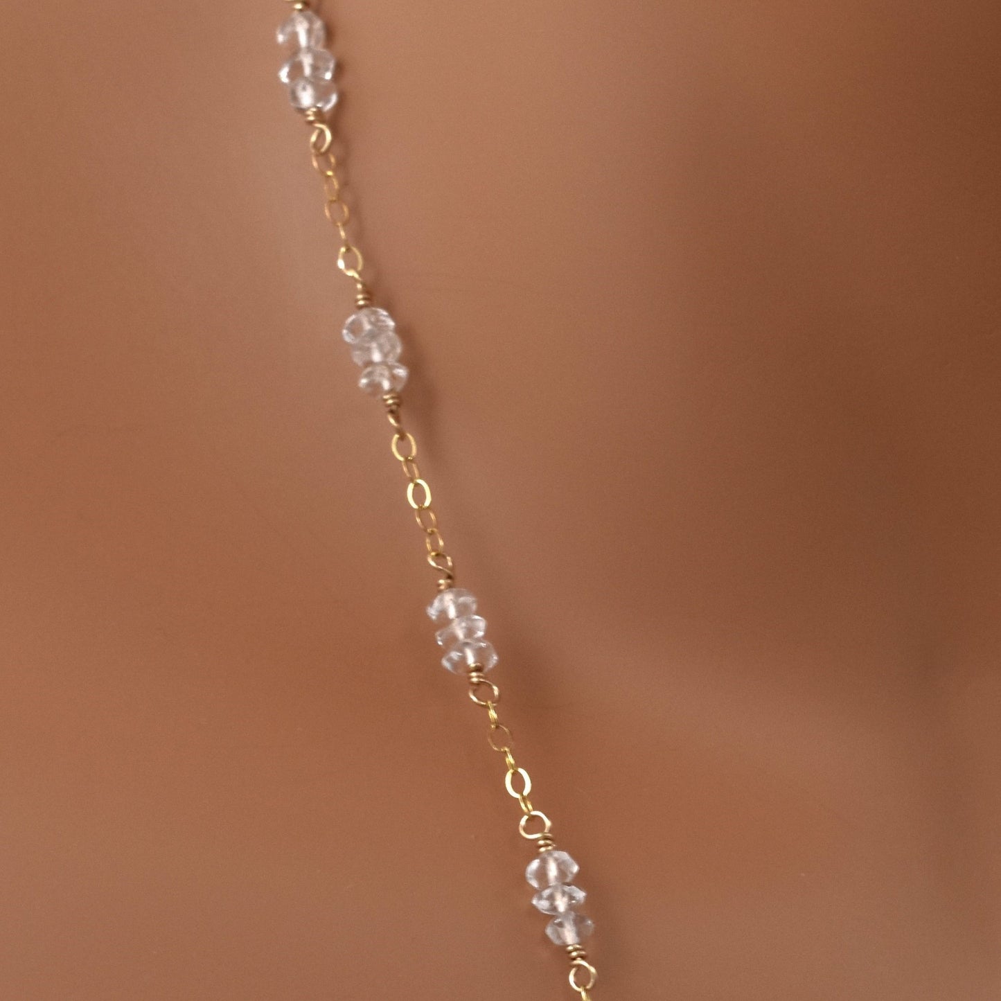 Clear quartz crystal bead necklace close up.