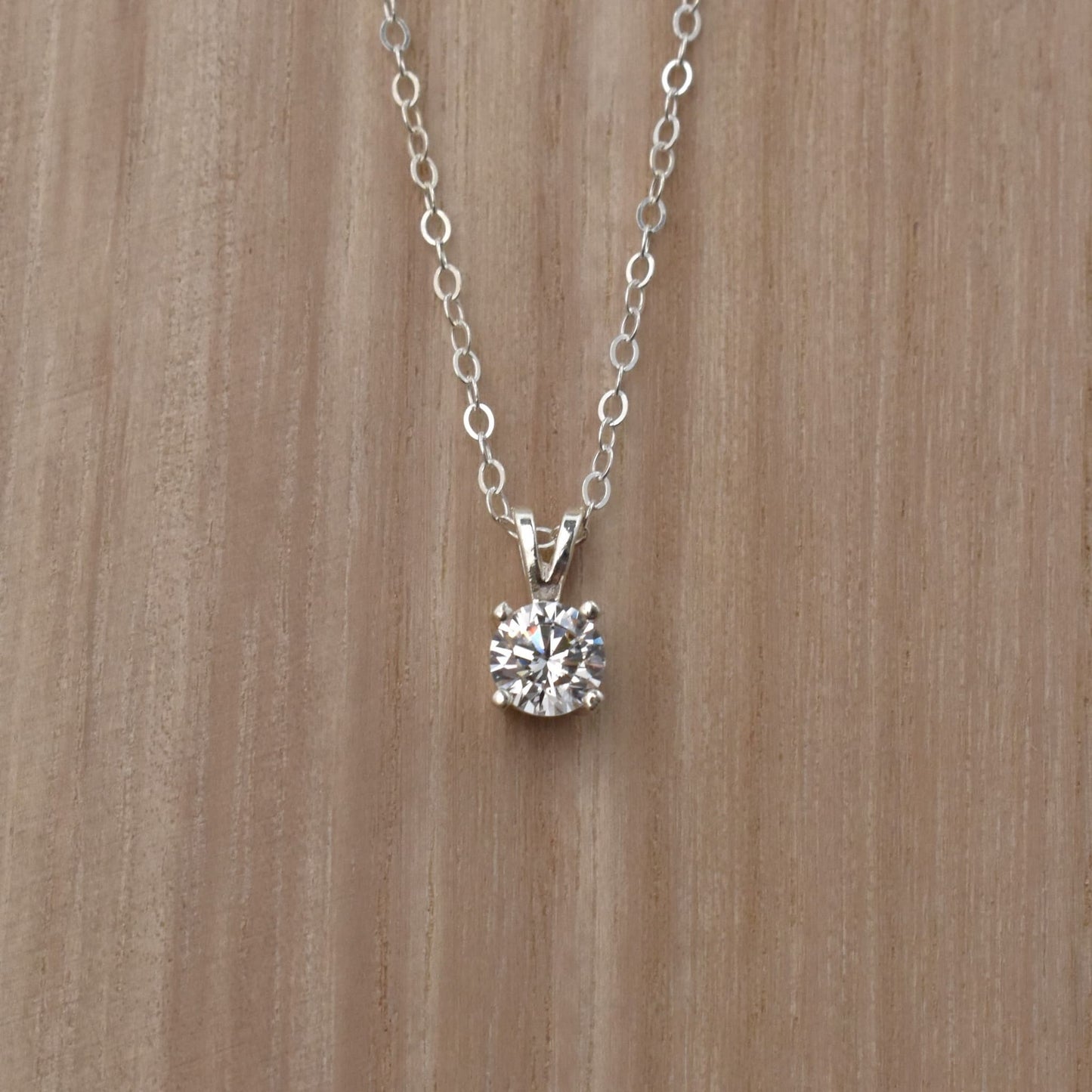 Cubic zirconia pendant necklace in sterling silver.