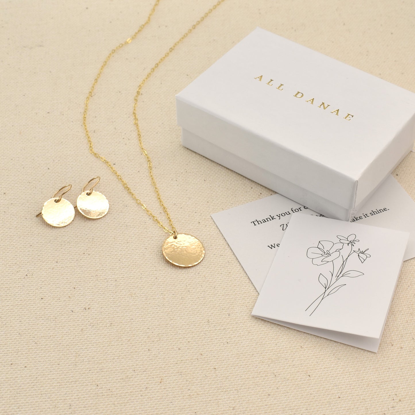 Gold circle necklace and earrings set.