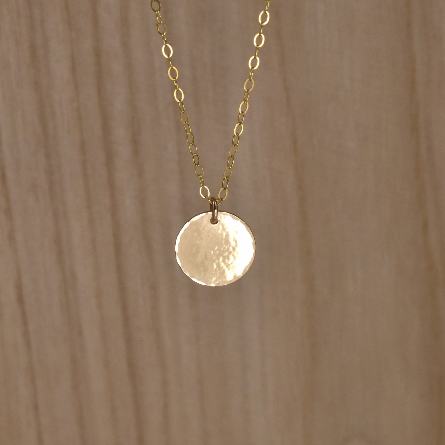 Gold hammered circle pendant necklace, size small.