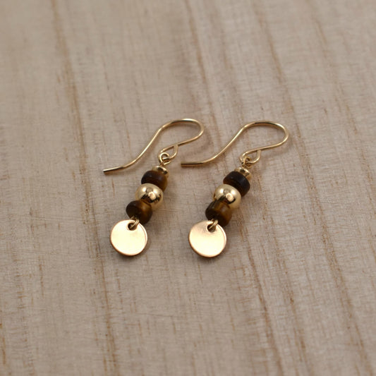 Gold drop earrings with tiger's eye gemstones.