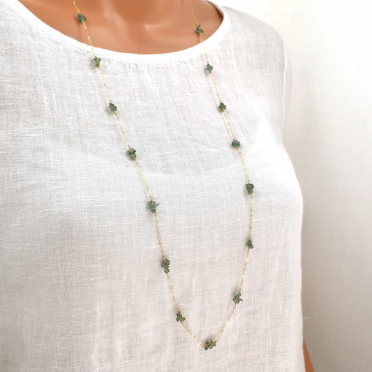 36-inch gold necklace with green apatite chip beads evenly spaced along the fine, lightweight chain.