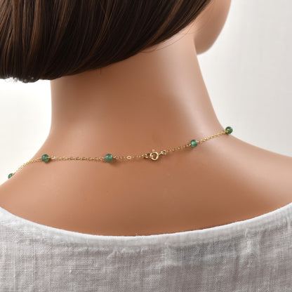 long gold necklace with green aventurine beads spring ring clasp.