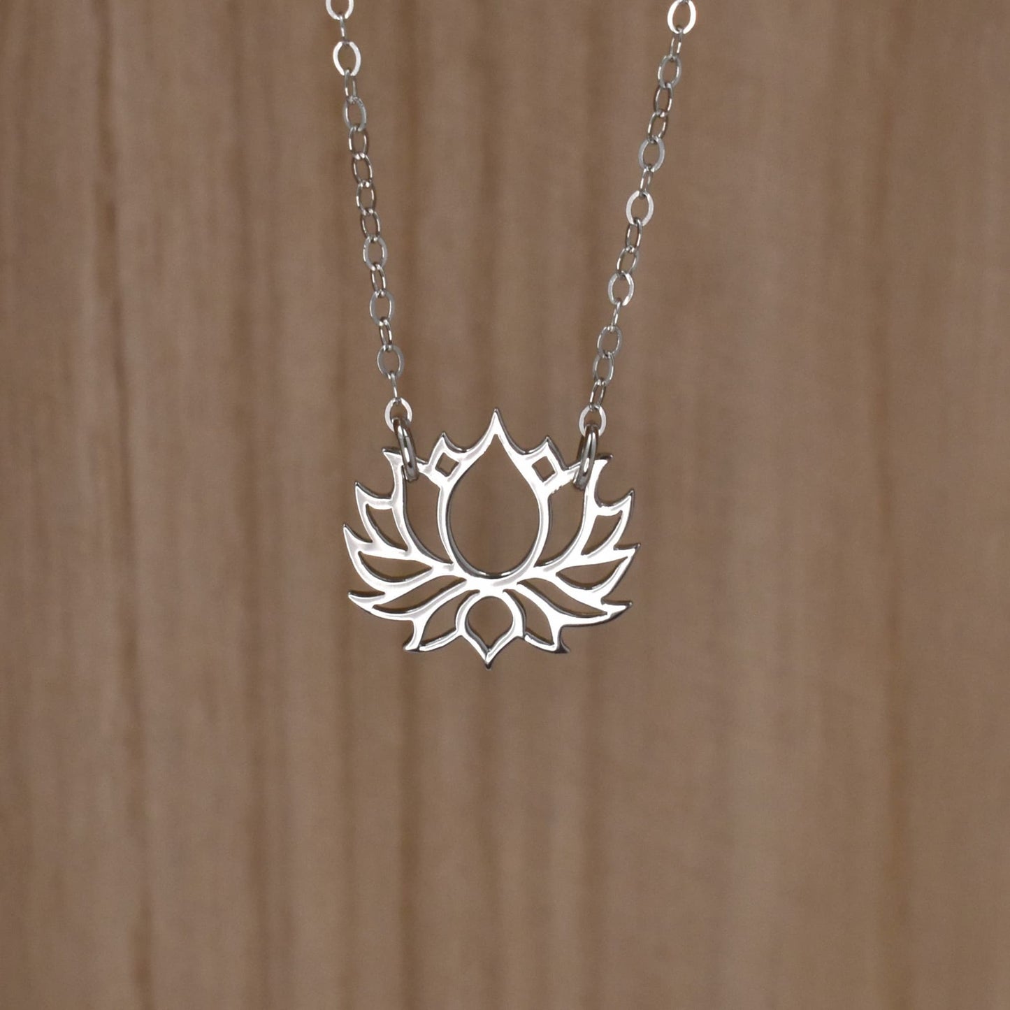 Lotus flower necklace in sterling silver.