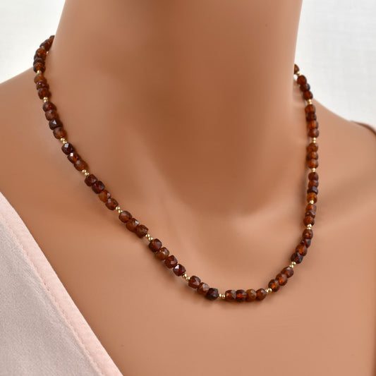 Red hessonite garnet necklace with gold beads.