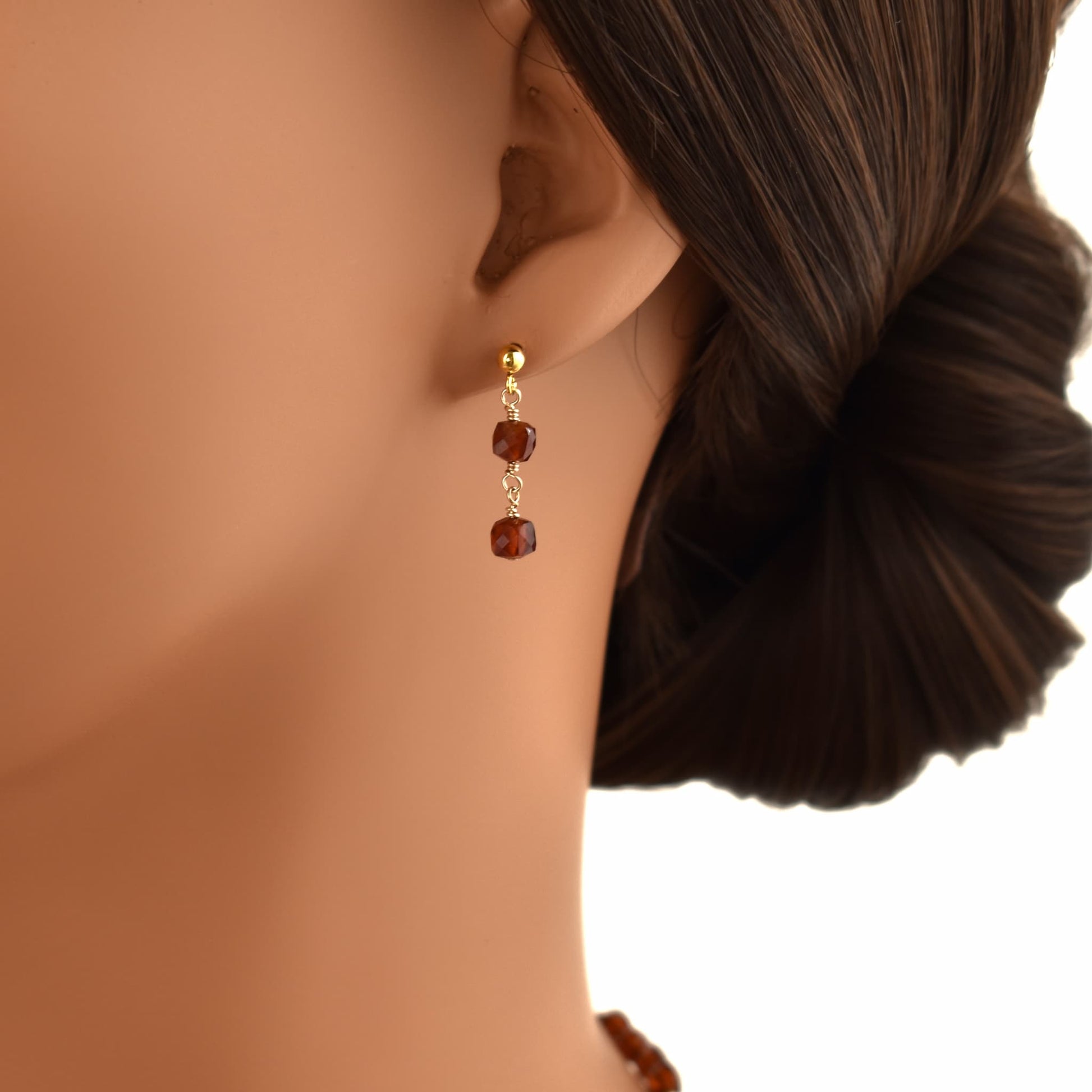 Hessonite garnet gold dangle earrings.