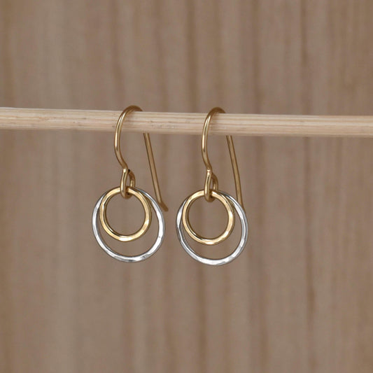 Gold and silver small circle drop earrings.